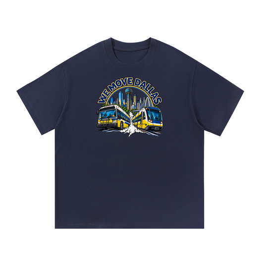 We Move Dallas Tee — navy heavyweight cotton with the DAL transit badge featuring the Dallas skyline, DART train, and bus, printed on the front.