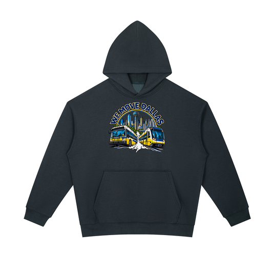 We Move Dallas Pullover Hoodie — navy heavyweight brushed fleece with the DAL transit badge printed on left chest and full back, featuring the Dallas skyline, DART train, and bus.